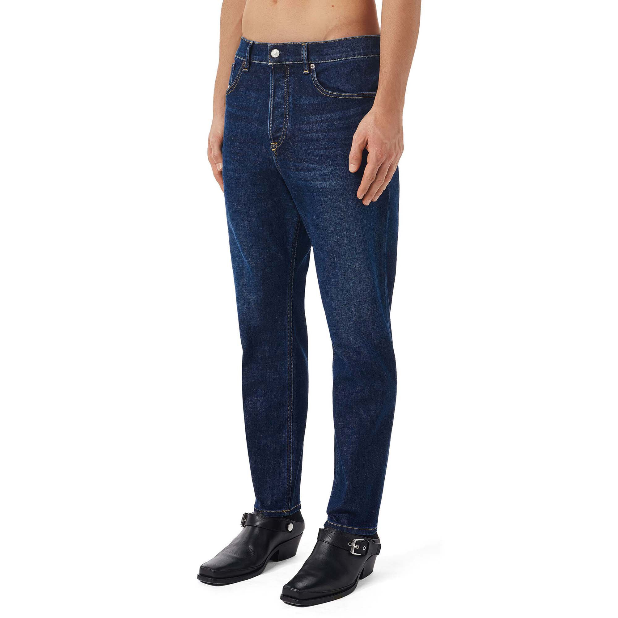 Side view of Diesel D-Fining 09B90 Tapered Fit Jeans in Medium Blue