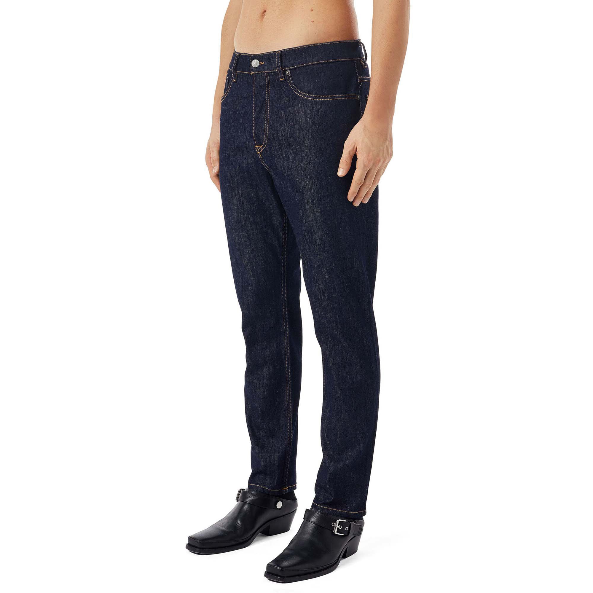 Side view of Diesel D-Fining Z9B89 Tapered Fit Jeans in Raw Rinse