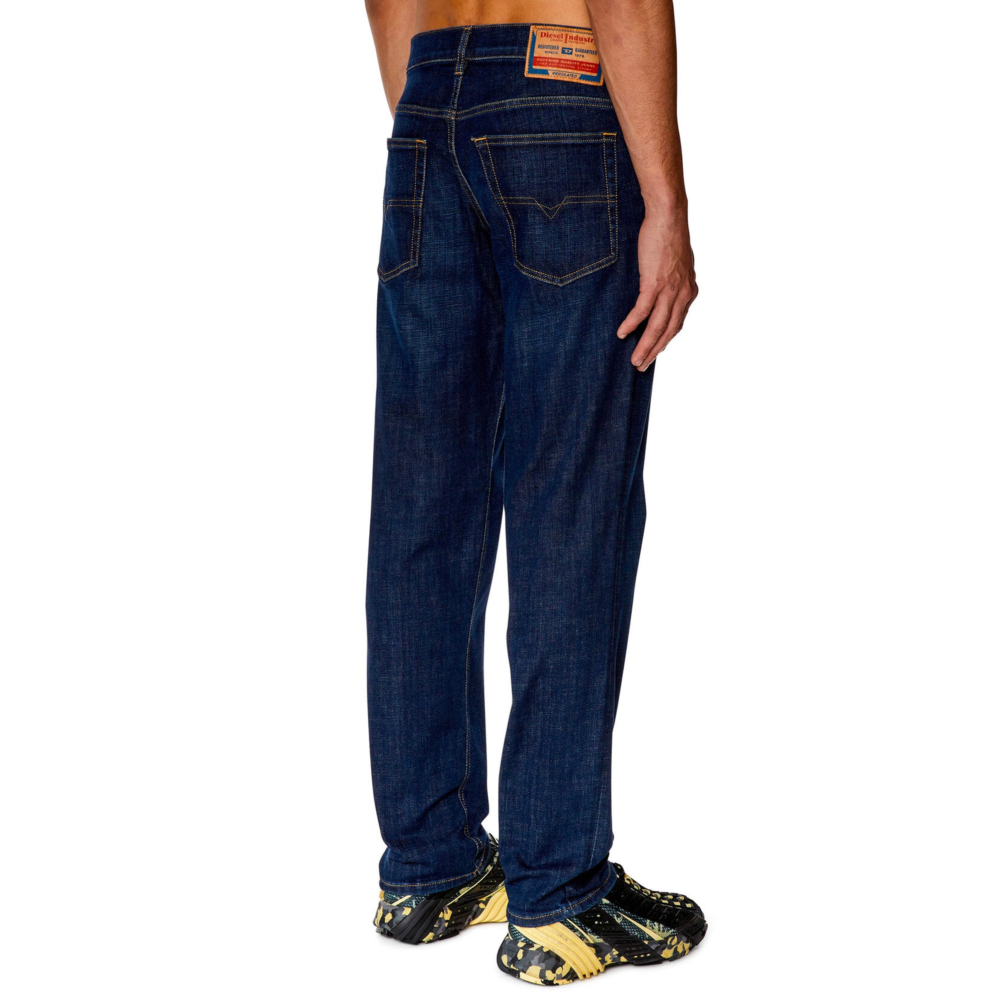 Rear view of Diesel D-Finitive 09F89 Tapered Fit Jeans in Dark Blue