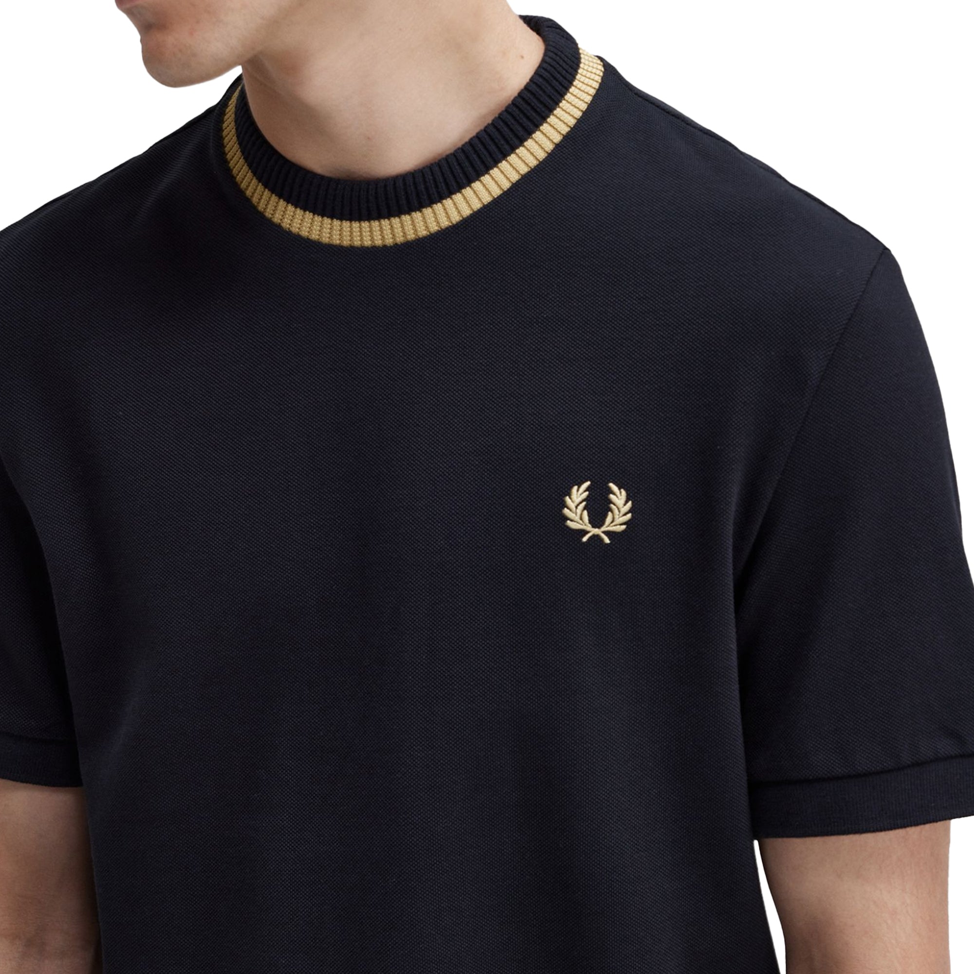 Close up of Laurel Wreath embroidery on Fred Perry Crew Neck Pique T-Shirt for Men in Black