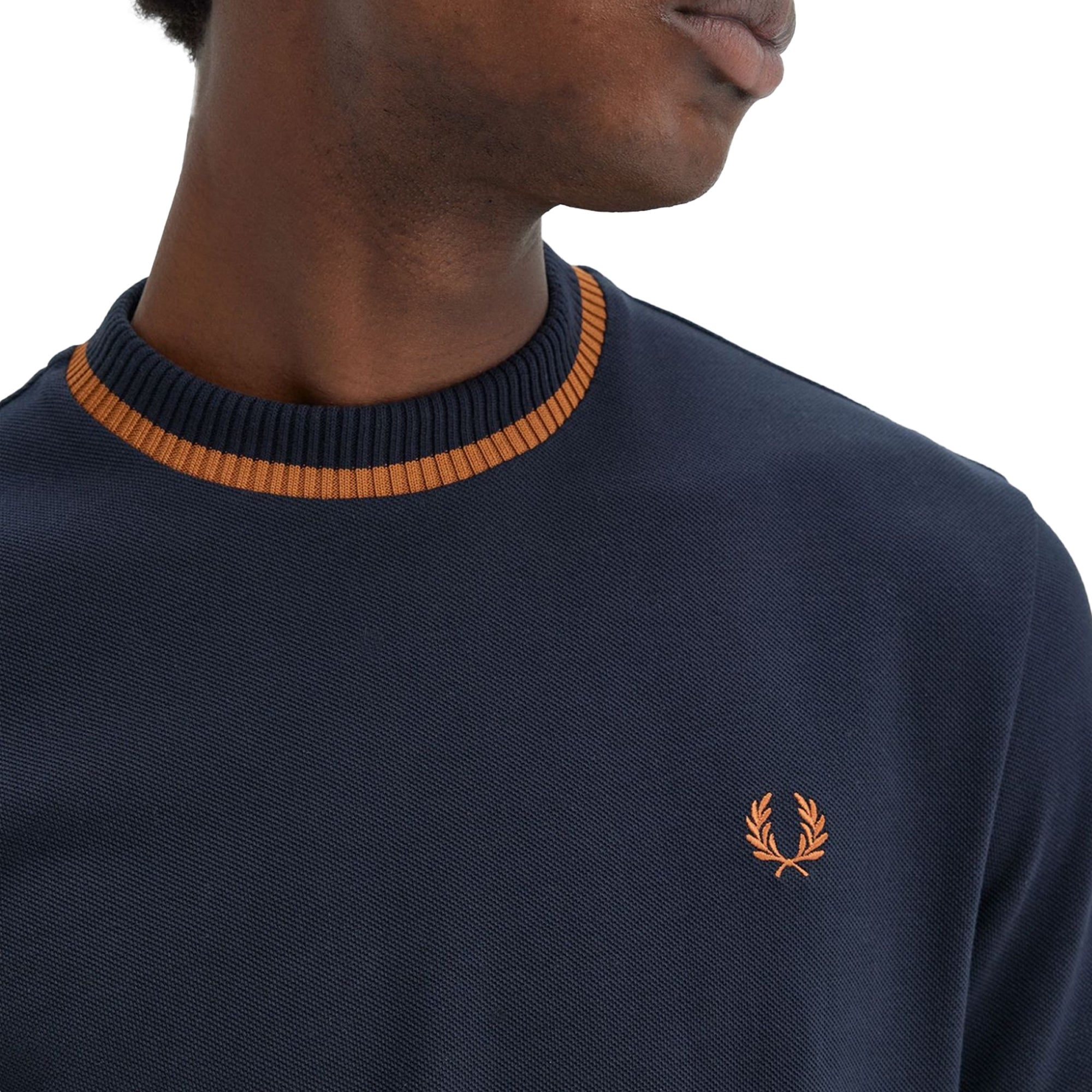 Close up of Laurel Wreath embroidery on Fred Perry Crew Neck Pique T-Shirt for Men in Navy